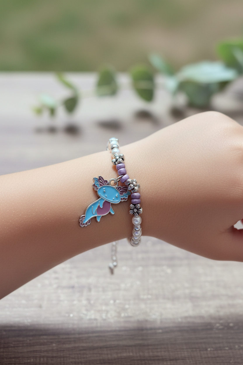 Child model wearing fish charm pearl bracelet